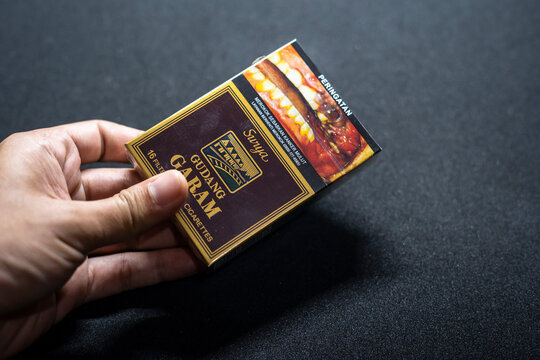 Jakarta, Indonesia. March 27, 2023: Surya Gudang Garam close up. Packaged cigarettes. Cigarette Surya Gudang Garam on isolated background