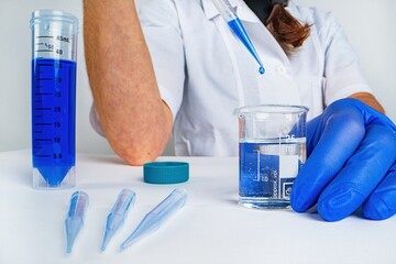 Scientist doctor pipetting samples in the lab