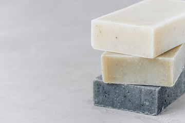 Soap. Organic soap bars. Stack of natural soap bars on gray stone background