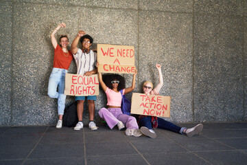 Portrait young protester friends holding equal rights signs