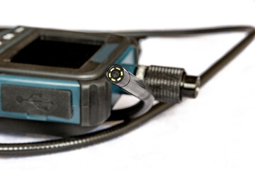Endoscope camera on the table. Flexible inspection camera - obrazy, fototapety, plakaty