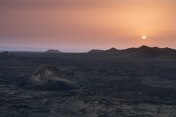 Sunset over the Landscape of Lanzarote with views of the volcanos