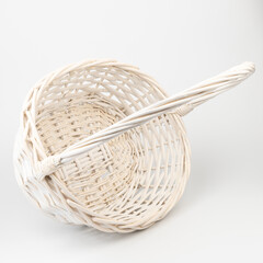 White wicker basket on white background. Used for storing items and reduce the waste of plastic bags.