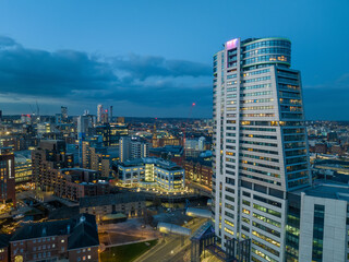 Naklejka premium Leeds City Centre and Bridgewater Place. Yorkshire Northern England United Kingdom. City centre at dusk, night lights aerial view