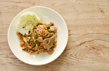Thai spicy chop pork and slice skin salad with fresh vegetable on plate