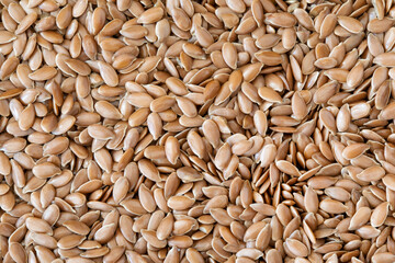 Flax seeds background, linseed, top view, Linum usitatissimum.
