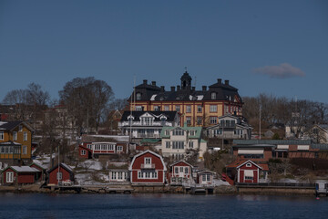 Old houses and villas in the archipelago island Vax&ouml;n, a sunny spring day in Stockholm 
