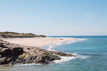 Fototapeta na wymiar Walk along the Atlantic Ocean on the beach called Praia da Ilha do Pessegueiro near Porto Covo, western Portugal. Steps over Rota Vicentina