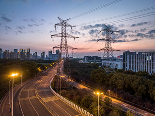 high-voltage power lines. high voltage electric transmission tower at sunset.