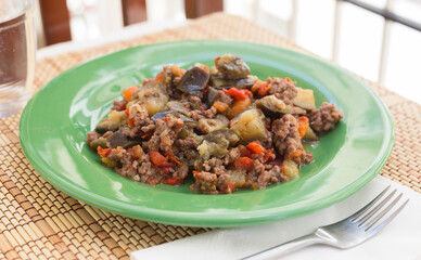 dish of vegetable stew. stewed eggplant, minced meat, carrots, peppers, onion squid
