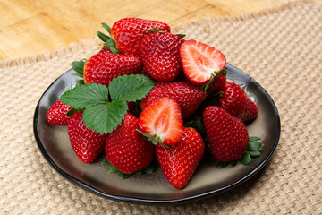 New harvest, board with fresh ripe red sweet Spanish strawberry