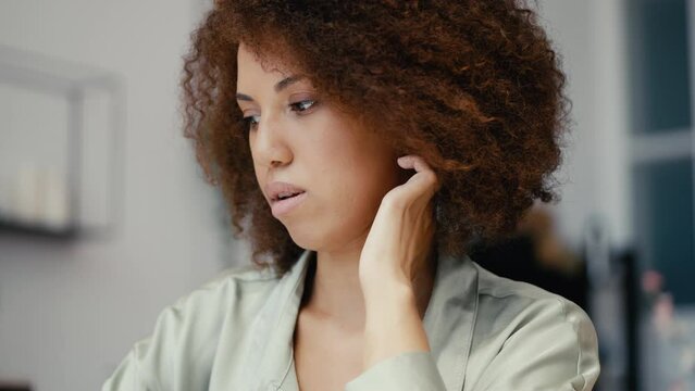 Nervous African American woman applying for a job, talking about work experience