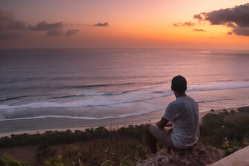 Lone Male Absorbing the Beauty of the Sunset at nyangnyang beach, Bali