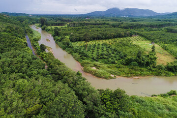 Fototapeta na wymiar Aerial view asphalt road in tropical rain forest