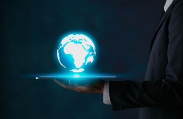 Blue Globe or World Trade Technology Concept on Tablet in Businessman Hand in Dark Tone