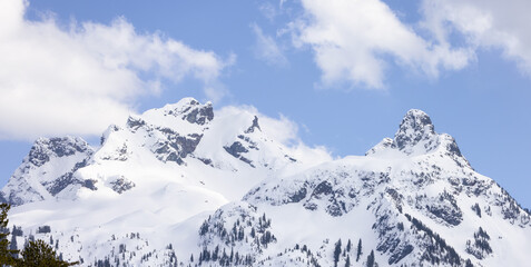 Fototapeta na wymiar Sky Pilot Mountain covered in Snow. Canadian Landscape Nature Background. Squamish, BC, Canada.