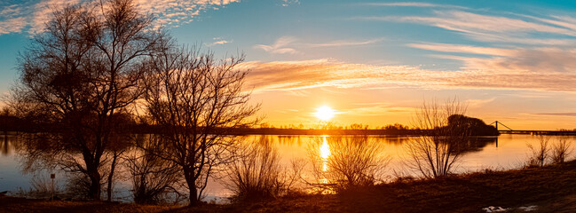 Fototapeta premium Sunset with reflections near Metten, Danube, Bavaria, Germany