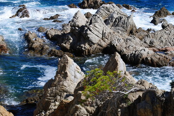 Naklejka premium rocks and waves in the meditterain sea