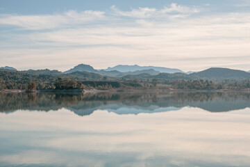 View of the mountains reflected in the crystalline waters of the Alfonso XIII reservoir in Calasparra, Region of Murcia, Spain