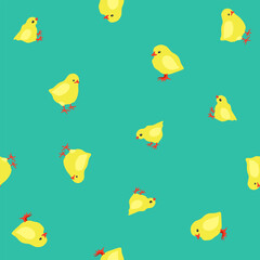 Fototapeta premium Vector seamless pattern with yellow chicks on bright blue-green grass. Happy Easter.