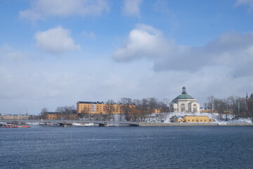 Fototapeta na wymiar Stockholm bridge in sunshine across the sea