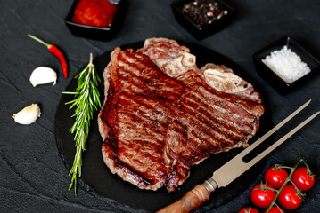 grilled T-bone steak on stone background