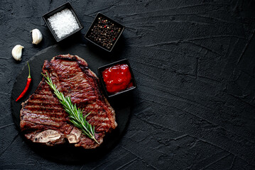 grilled T-bone steak on stone background with copy space for your text