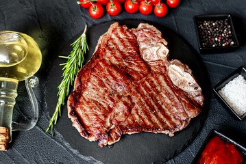 grilled T-bone steak on stone background
