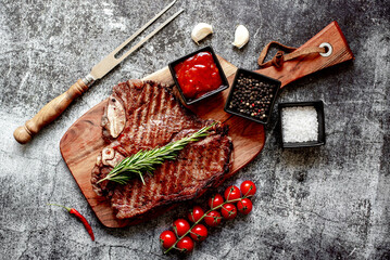 grilled T-bone steak on stone background