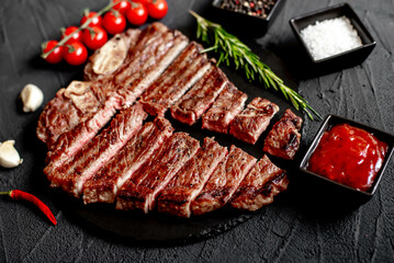 grilled T-bone steak on stone background