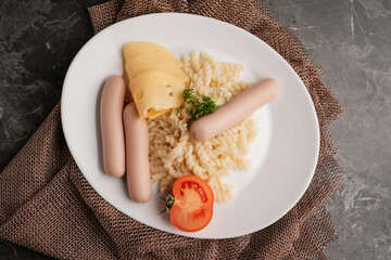 Sausages with pasta cheese and tomato