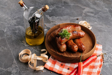 grilled sausages decorated with herbs and pepper