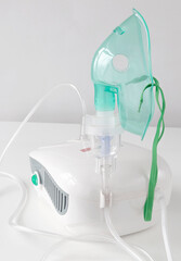 Medical equipment for inhalation with a respiratory mask nebulizer on a white background