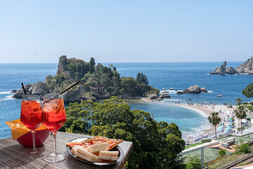Spritz and snacks in front of the Mediterranean beach