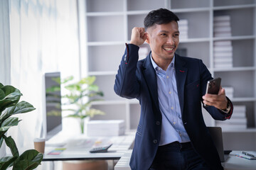 Portrait of Smiling young male employee feel euphoric with promotion offer in paperwork letter in...