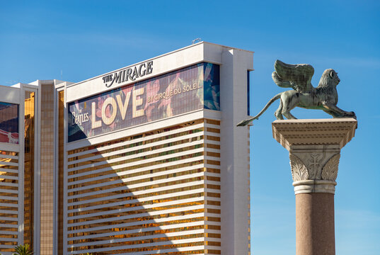 Las Vegas, United States - November 24, 2022: A picture of the Mirage with an ad for the show Love by Cirque du Soleil, about the Beatles, on its facade. The St. Mark column is also on the right.