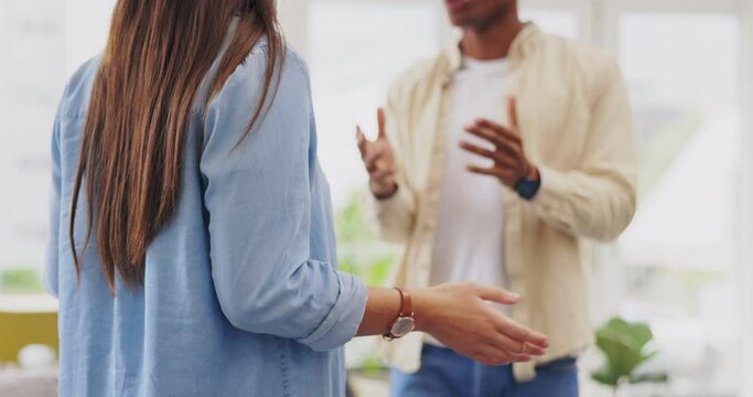 Argument, conflict and couple talking in the living room for divorce, cheating or toxic problem. Angry, disagreement and young man and woman fighting for breakup or affair in their home or apartment.