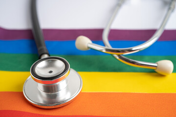 Black stethoscope on rainbow flag background, symbol of LGBT pride month celebrate annual in June...