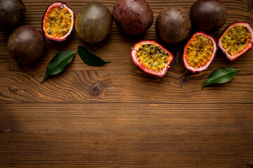 Flatlay of whole and half of fresh passion fruit - marakuya