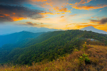 Fototapeta na wymiar beautiful mountain and sky scenery,mountains under morning mist Amazing natural scenery forms Kerala. Country travel gods and tourism concept images, fresh and relaxing nature images.