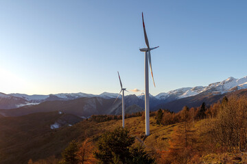 Wind turbines in mountains, Alps, Italy