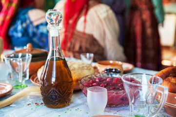 Alcohol Tincture on the table with authentic slavic snacks. Feast