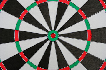 Abstract multicolored background closeup dartboard.