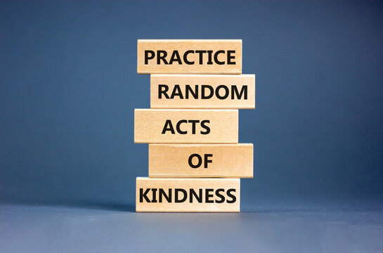 Practice random kind of kindness symbol. Concept words Practice random kind of kindness on wooden block. Beautiful grey table grey background. Business practice kindness concept. Copy space.