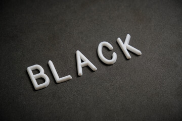 Fototapeta premium Inscription black, in white letters black background.