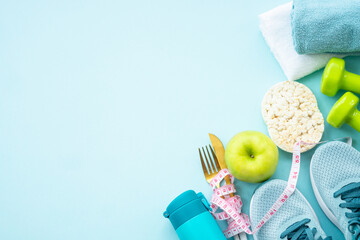 Healthy lifestyle, fitness and diet concept. Top view on blue background.