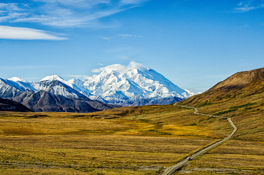 Tour Bus Driving Past Denali in Denali National Park, Alaska