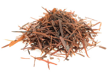 Pile of natural Taheeboo dry tea isolated on a white background. Lapacho herbal tea. Tabebuia heptophylla.