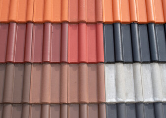 Colorful ceramic roof tiles close in shop