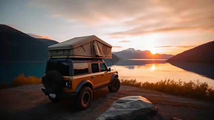 Tuinposter A car for adventures, camping at sunset © Vladimir